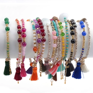 Bohemian natural crystal beaded bracelets with silk tassels and gold spacers in various colors