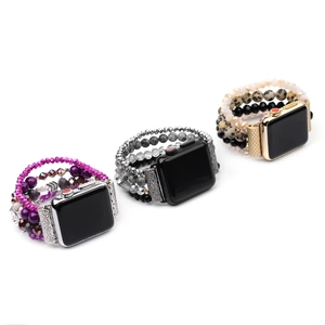 Detail showing various beaded Apple Watch bands with crystal and natural stone elements