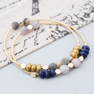 Two-piece bohemian stackable bracelets with colorful wood beads and gold metal coils