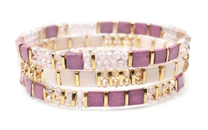 Detailed macro view of 3-piece Miyuki Tila beaded bracelets with purple and white square tiles