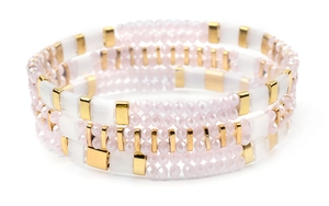 Detail view of multi-layer Miyuki Tila handmade beaded bracelets with pink and gold beads