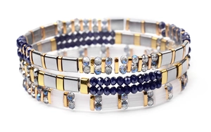 Macro shot of three stacked Tila beaded bracelets with gold and crystal beads