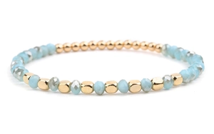 Detailed close-up of DIY beaded bracelet with gold accents and light blue crystal beads