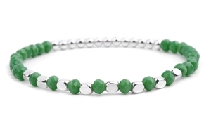 Macro shot of green faceted crystal beads and silver metallic square beads on the DIY bracelet