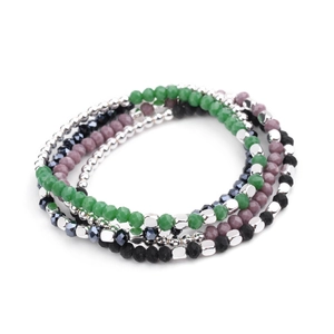 Detailed view of bohemian multi-layer bracelets with faceted green, purple and black beads