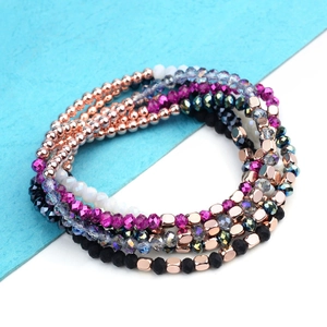 Detail of multi-layered beaded bracelets with hematite, acrylic, and crystal elements