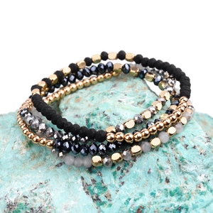 Four-piece stackable beaded bracelet set with crystal, acrylic beads and gold accents