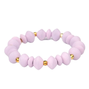 Detail view of elastic beaded bracelet featuring lavender matte beads and gold spacers