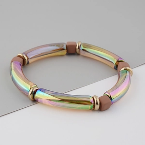 Detailed view of iridescent acrylic tube bracelet with metallic rainbow finish and gold beads