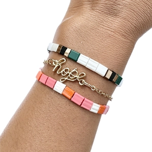 Three-piece Tila bead bracelet set featuring HOPE letter pendant on a model's wrist