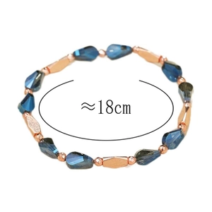 Blue teardrop crystal beaded bracelet with rose gold metal accents, 18cm inner circumference