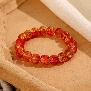 Bracciale con perle di vetro craquelé rosso arancio 8mm e motivo floreale stile vintage