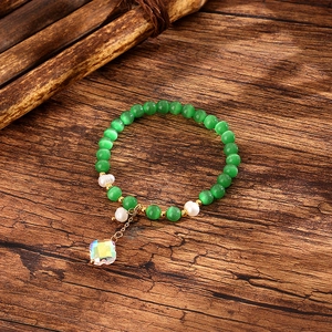 Sweet green cat-eye stone bracelet with fresh water pearls and crystal clover charm