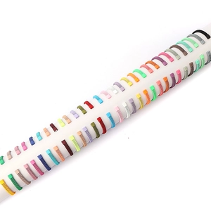 Colorful woven stainless steel mesh expandable bracelets displayed on a white stand