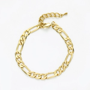 Detailed close-up of golden Figaro chain anklet with lobster clasp and extension