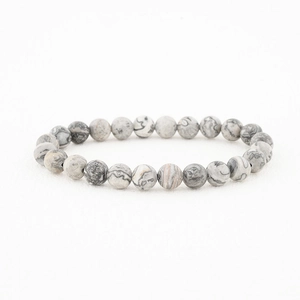 Detailed view of 8mm gray and white map jasper natural stone beads on elastic bracelet