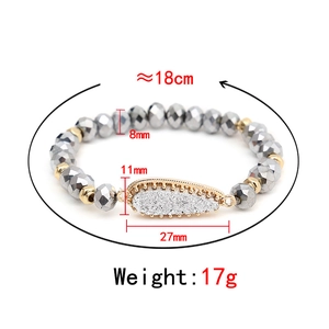 Grey beaded bracelet with gold accents and a teardrop charm, 18cm length jewelry