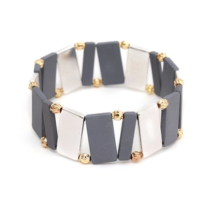 Detailed close-up of Miyuki grey and silver beads with gold spacers on a beaded bracelet