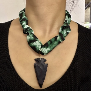 Green camouflage silk scarf necklace featuring a matte black arrowhead stone pendant