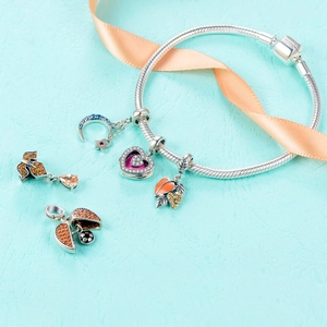 Elegant S925 sterling silver charm bracelet with blue moon and leaf pendants on snake chain