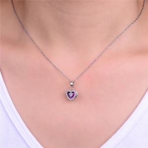 Detail of 925 sterling silver heart locket pendant necklace with sparkling pavé crystals