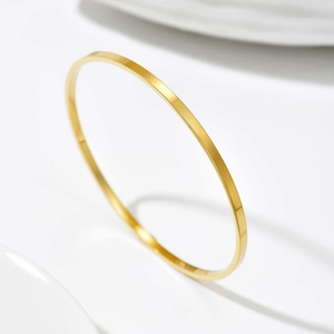 Minimalist 14k gold-plated stainless steel slim bangle with high-polished mirror finish