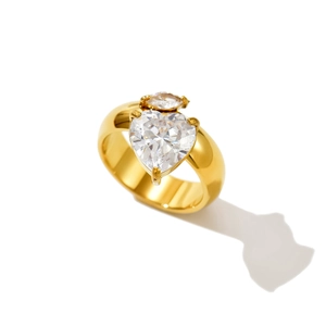 Macro shot of 14k gold plated double heart-shaped cubic zirconia stones on ring