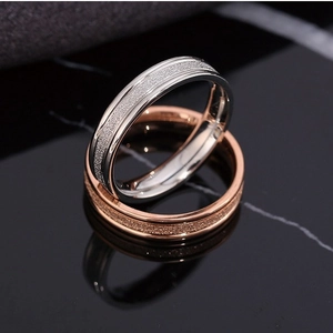 Pair of minimalist sandblasted titanium steel rings in silver and rose gold finish