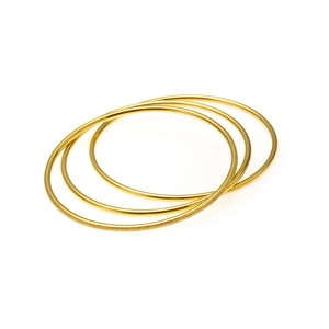 Set of three golden titanium steel bangles with polished and frosted matte finishes