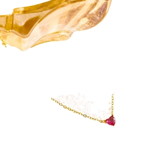 Elegant gold chain necklace featuring a faceted red heart-shaped July birthstone pendant
