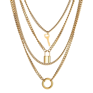 Gelaagde vintage gouden ketting met sleutel-, hartslot- en ronde ringhangers