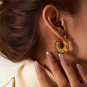French style gold hollow hoop earrings with textured spiral design for elegant women