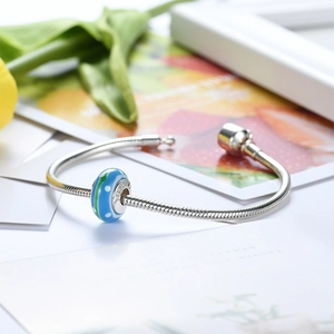 S925 sterling silver snake chain bracelet featuring a blue and green glass bead