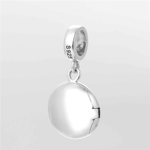 Macro shot of S925 sterling silver locket charm with polished finish and openable design