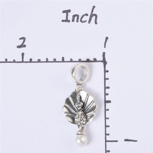 Detail view of S925 sterling silver peacock pendant with pearl and inlaid crystals