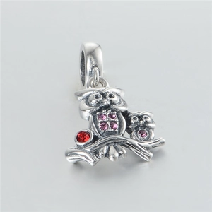 Detailed S925 silver owl charm featuring pink crystals and a red gemstone on a branch