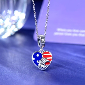 S925 sterling silver heart charm with American flag enamel and eagle head detail
