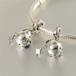 Detail of S925 sterling silver snake chain bracelet with colorful crystal egg pendants