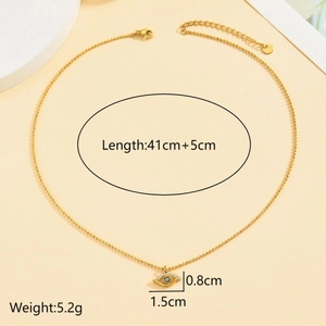 Close-up of gold Evil Eye pendant with clear crystals and dimensions of 1.5cm by 0.8cm
