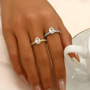 Elegant stainless steel ring with oval zircon main stone and pavé setting on gold band