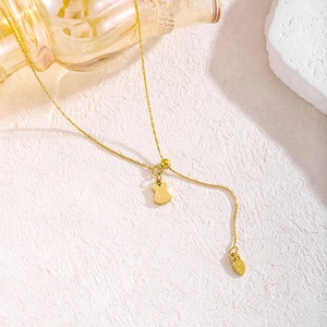 Adjustable golden necklace featuring cute bunny and carrot pendants on fine chain
