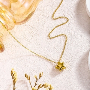 Elegant 18K gold plated stainless steel star pendant necklace on a clean white background