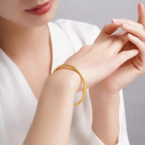 Minimalist matte gold titanium steel bangle for women in a classic round solid design