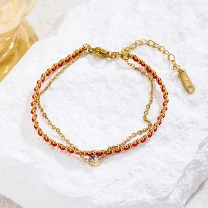 Double-layered red rope and gold titanium steel bracelet with single zircon and K18 tag