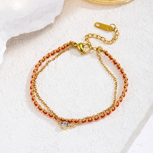 Double-layer gold stainless steel and red rope bracelet with a central zircon stone