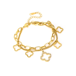 Golden double-layer clover bracelet featuring zircon inlay and hollow pendants for women