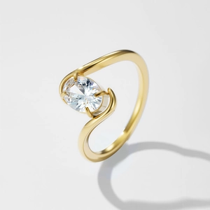 Elegante anello in acciaio inossidabile dorato con fascia a S e cristallo ovale chiaro