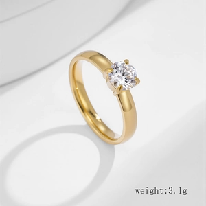 Anello minimalista in acciaio inossidabile dorato con diamante solitario tondo a quattro punte