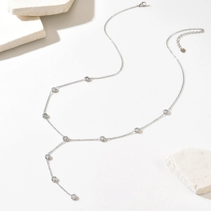 Silver Y-shaped stainless steel necklace with round cubic zirconia and tassel drop