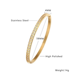 Detail showing 4mm wide gold plated stainless steel bangle with zircon and rhombus pattern